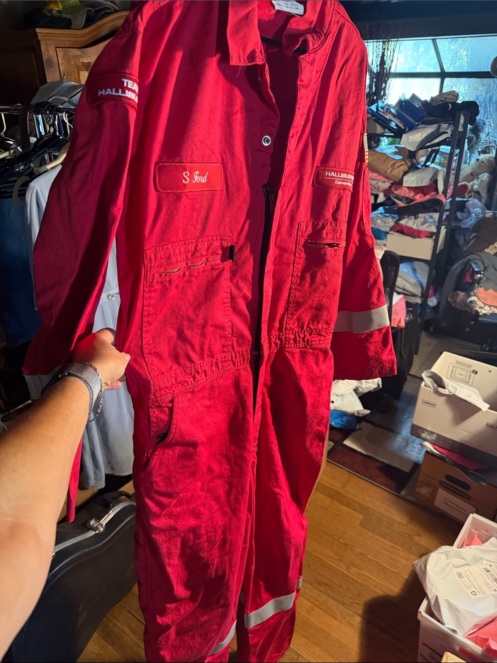 Men’s red coverall/one-piece Halliburton outerwear. Has a few imperfections.